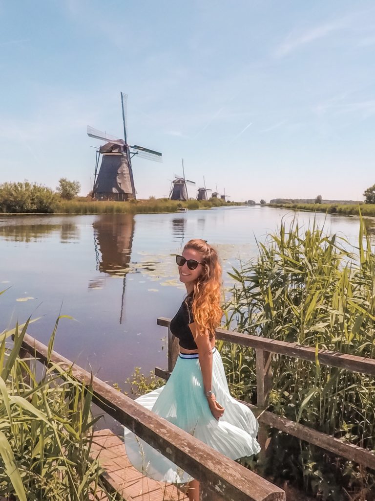Eef at Kinderdijk with a Dutch windmill