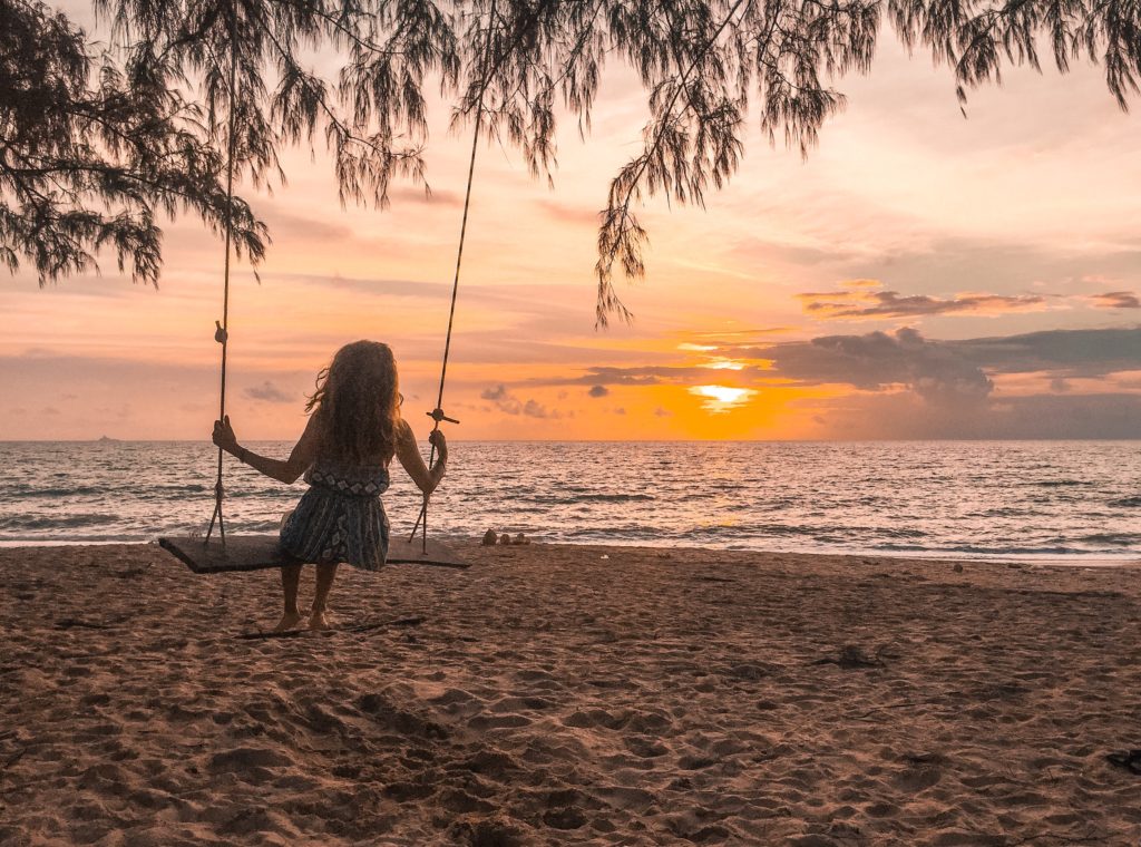 Swinging at a beach in Thailand during sunset