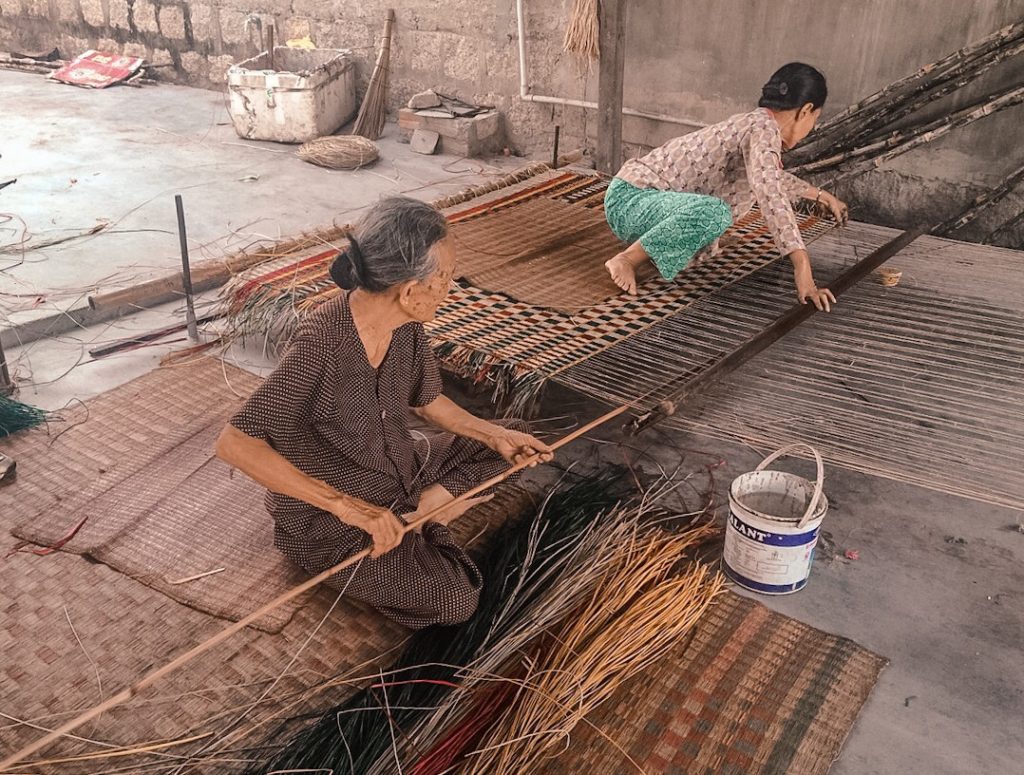Local Vietnamese ladies making beds